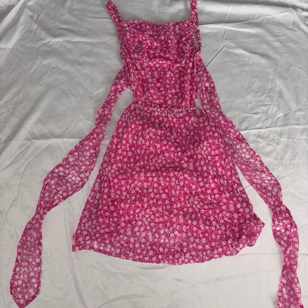 Pink dress from cousin couture with flower details